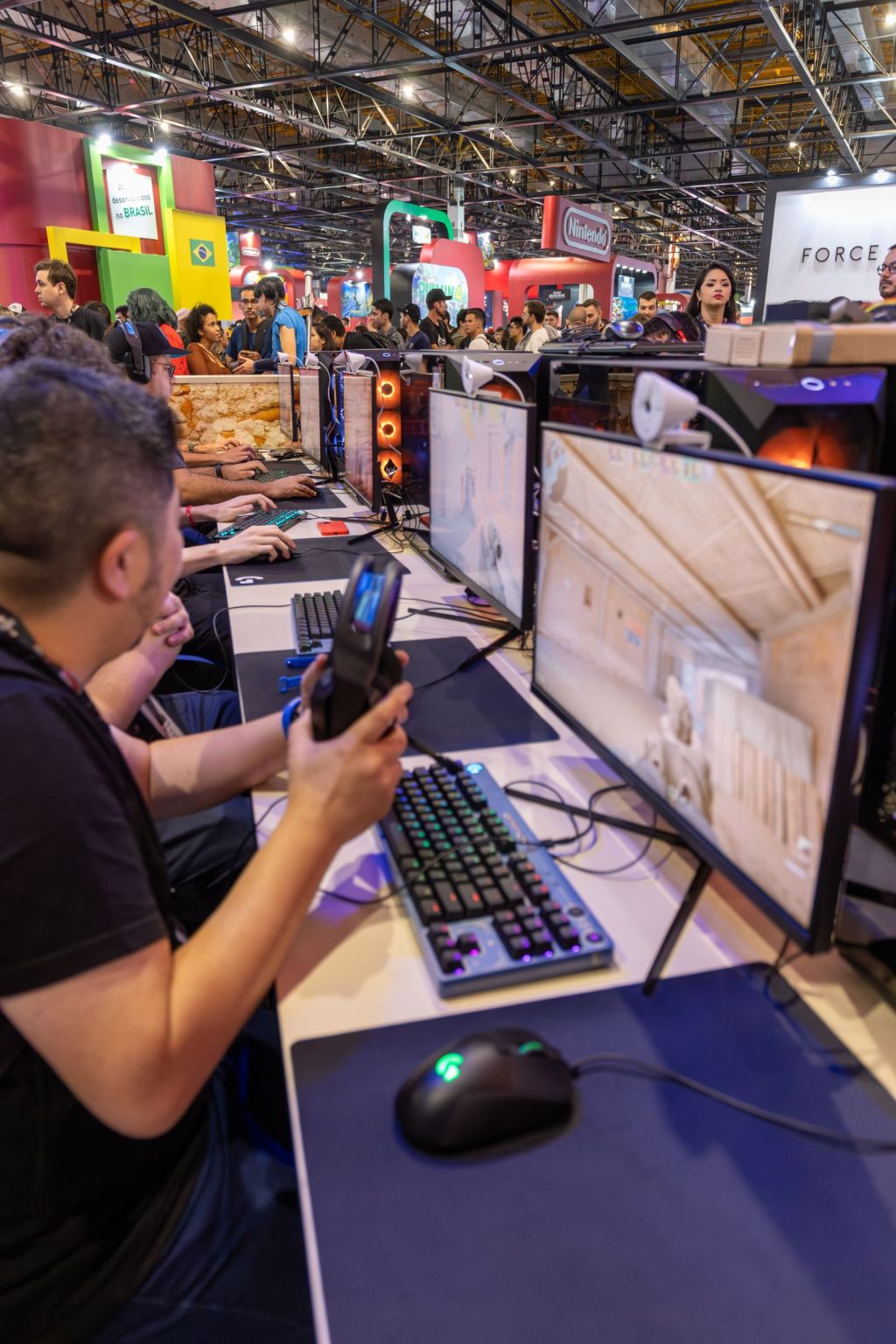 people playing computer games at a convention