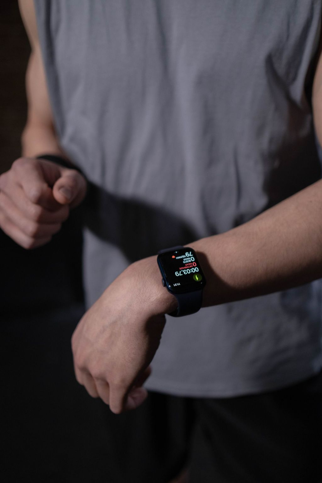 close up view of a person wearing black smartwatch